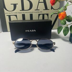 Prada Gold and Black Oval Sunglasses